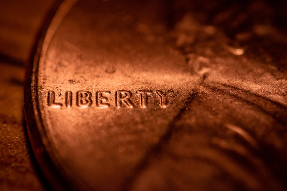 A close-up image of a 1909 VDB penny showing the initials VDB on the reverse side