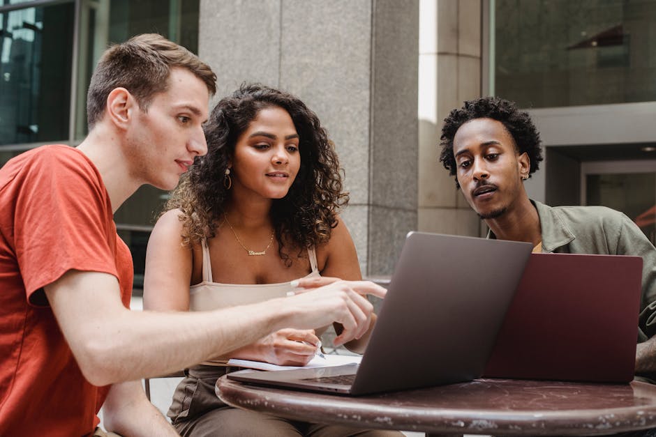 A group of diverse students collaborating on a project in a modern classroom setting