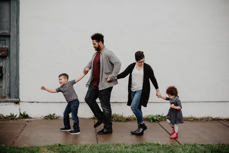 An image of a family with kids enjoying outdoor activities around their RV