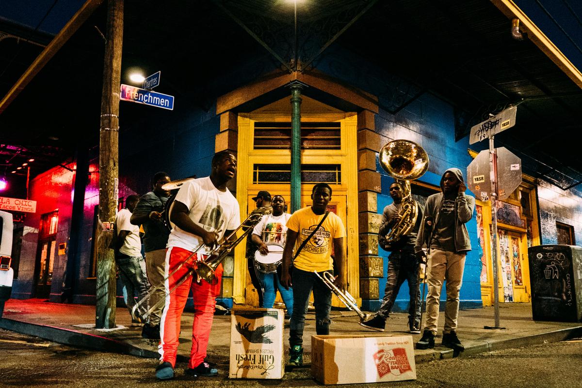 A group of jazz musicians performing on stage at a dimly lit jazz club