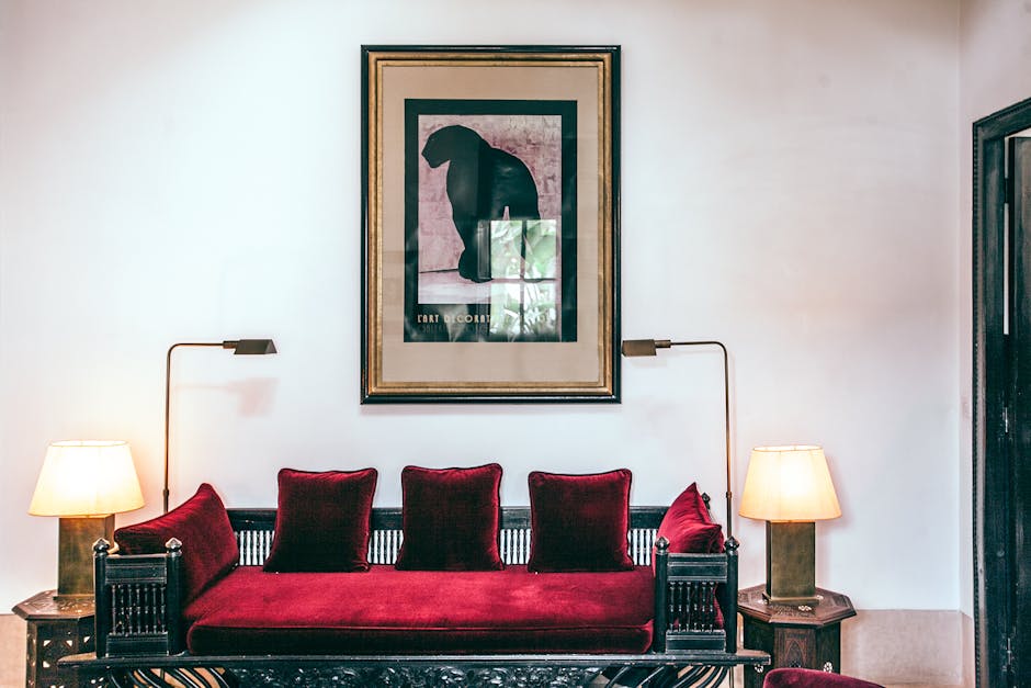 A living room with bold red accents against a neutral backdrop.