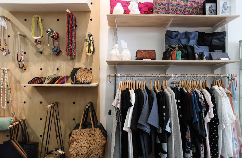 A person organizing clothes in a closet to declutter and create a more organized living space