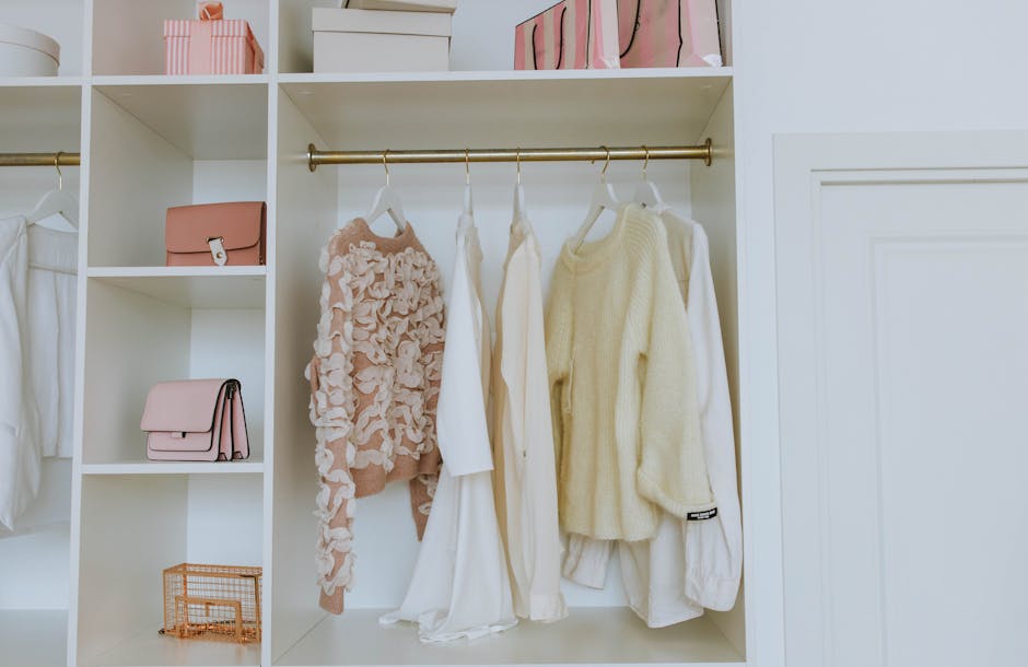 image of organized closet shelves and drawer with clothing neatly folded and hung, showcasing efficient closet organization