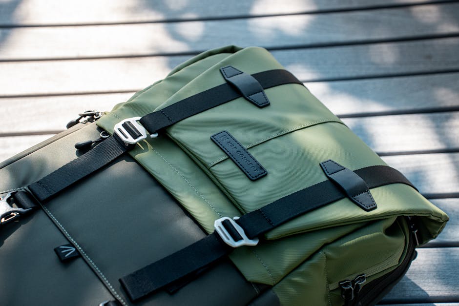 The Fieldsmith Roll-Top Pack showcasing its 30-liter capacity, full-height front pocket, and side quick-stash pockets for storage and organization.