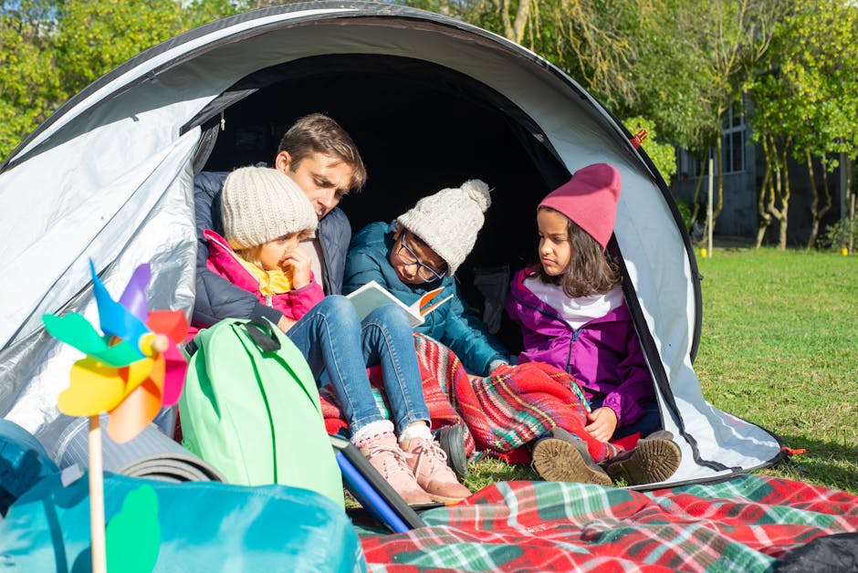 RV parked in a scenic location with a family outside enjoying nature