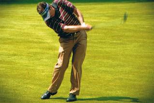 A golfer practicing golf drills with discipline and focus to improve their skills