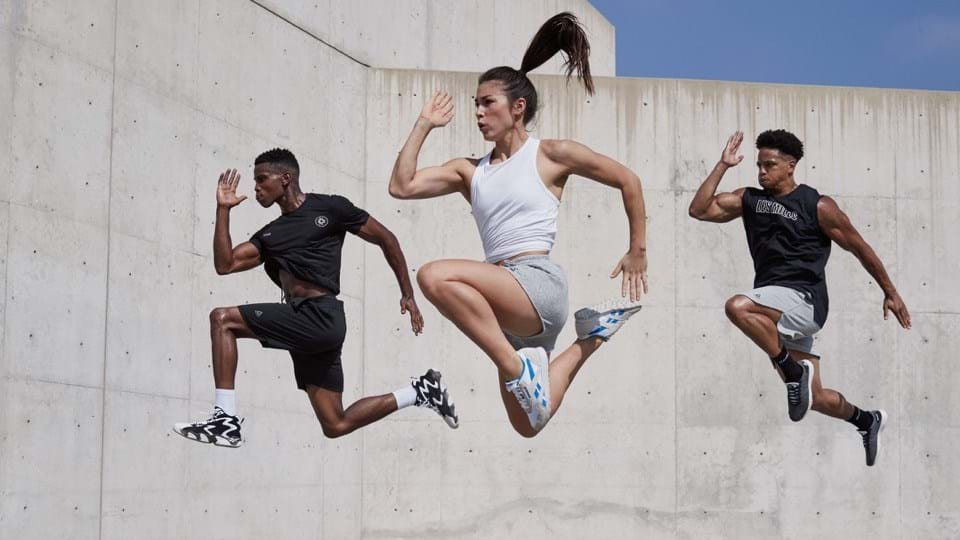 A person performing a high-intensity interval training exercise, such as sprinting or doing burpees, showcasing the intense and fast-paced nature of HIIT workouts.