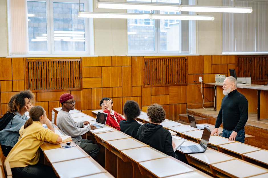 A diverse group of students engaged in a classroom discussion with a teacher