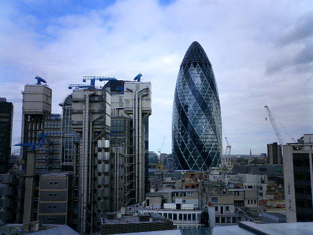 The Gherkin skyscraper standing out in London's skyline, with its distinctive bullet-shaped design
