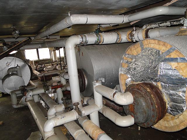 A heat-only boiler system with a separate hot water storage cylinder and cold water storage tank, illustrating the traditional setup commonly found in older UK homes.