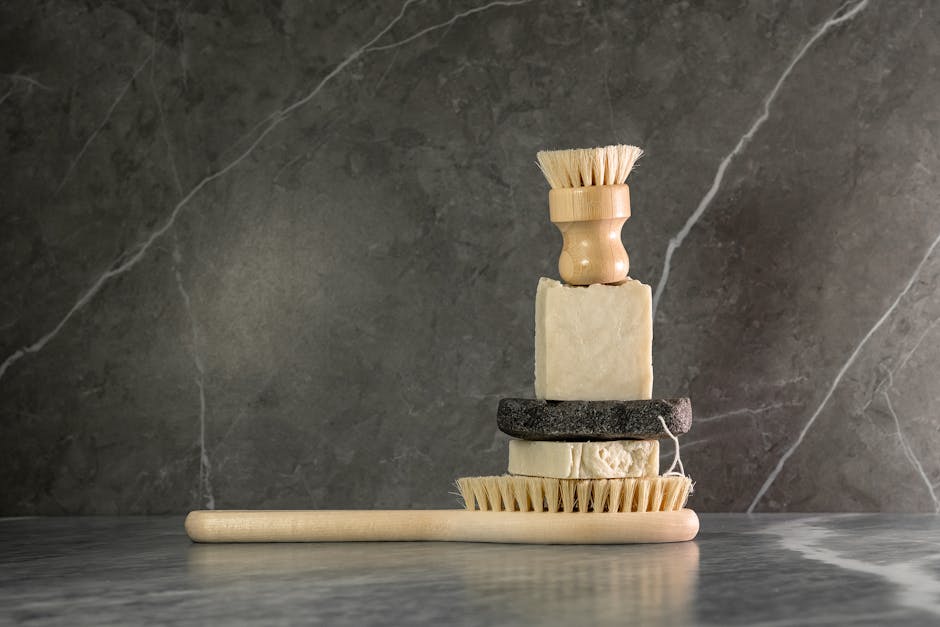 A collection of modern wet shaving tools and products displayed on a wooden countertop