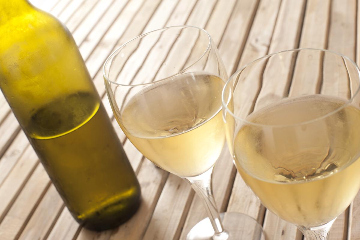 A glass of white wine with a bright, crisp appearance.