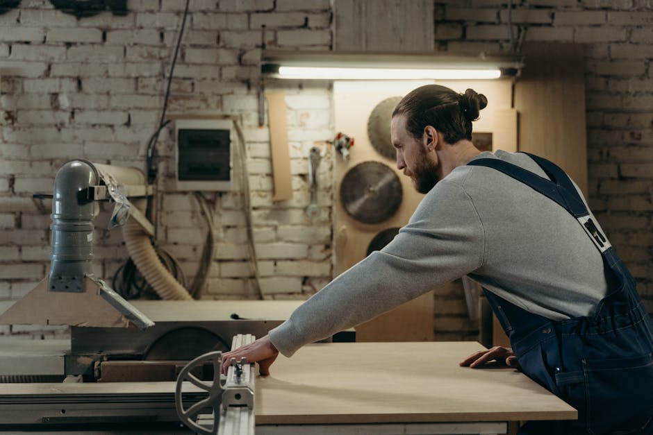 A woodworker using proper techniques to avoid kickback when operating a table saw.